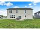 A spacious backyard featuring a well-maintained lawn and a patio area, perfect for outdoor gatherings at 5366 Laurel Crest Run, Noblesville, IN 46062