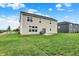 A spacious backyard featuring a well-maintained lawn and patio area, great for outdoor activities at 5366 Laurel Crest Run, Noblesville, IN 46062
