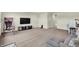 Spacious basement living area with comfortable seating, a large TV, and fun recreational features at 5366 Laurel Crest Run, Noblesville, IN 46062