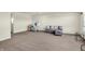 Open basement area features a comfortable couch and desk setup, creating a versatile living space at 5366 Laurel Crest Run, Noblesville, IN 46062