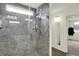 Walk-in shower with gray subway tile, a rain shower head, a window, and a glass door at 5366 Laurel Crest Run, Noblesville, IN 46062