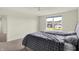 Bedroom featuring a large window with neighborhood views and a ceiling fan at 5366 Laurel Crest Run, Noblesville, IN 46062