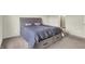 Bedroom with a gray bed frame with built-in drawers and dark-colored blanket at 5366 Laurel Crest Run, Noblesville, IN 46062