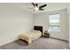 Bright bedroom featuring neutral walls, carpet, a ceiling fan and a window at 5366 Laurel Crest Run, Noblesville, IN 46062