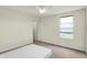 Empty bedroom featuring neutral walls, carpet and a window at 5366 Laurel Crest Run, Noblesville, IN 46062