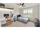 Bedroom featuring a desk, bed, ceiling fan, and a view of the neighborhood at 5366 Laurel Crest Run, Noblesville, IN 46062
