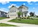Charming two-story home with green lawn, two-car garage, manicured landscaping, and inviting front porch at 5366 Laurel Crest Run, Noblesville, IN 46062