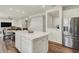 Bright kitchen featuring quartz countertops, stainless steel appliances, and a center island with room to gather at 5366 Laurel Crest Run, Noblesville, IN 46062