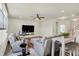 Bright living room with natural lighting, wood floors, and a flat-screen TV at 5366 Laurel Crest Run, Noblesville, IN 46062