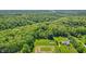 Aerial view of a home surrounded by lush greenery and mature trees in a secluded location at 5920 Crooked Creek E Dr, Martinsville, IN 46151