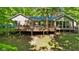 House with an expansive backyard view with a large wooden deck and lots of natural sunlight at 5920 Crooked Creek E Dr, Martinsville, IN 46151