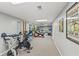 Basement gym area transitions to a finished living space with leather couch and a play area at 5920 Crooked Creek E Dr, Martinsville, IN 46151