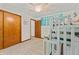 Bedroom with bunkbeds, ceiling fan, closet and wood doors, and world map wall decor at 5920 Crooked Creek E Dr, Martinsville, IN 46151