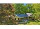 Beautiful brick home surrounded by lush greenery and mature trees in a peaceful setting at 5920 Crooked Creek E Dr, Martinsville, IN 46151