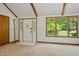 Bright foyer with a coat rack, a large window with scenic outdoor views and white front door at 5920 Crooked Creek E Dr, Martinsville, IN 46151