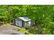Spacious detached garage with a basketball hoop, nestled among the trees at 5920 Crooked Creek E Dr, Martinsville, IN 46151
