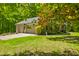 Charming brick house with a two-car garage, lush landscaping, and beautiful curb appeal at 5920 Crooked Creek E Dr, Martinsville, IN 46151
