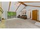 Comfortable living room features a sliding door to deck and vaulted ceilings with wood beams at 5920 Crooked Creek E Dr, Martinsville, IN 46151