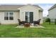 Private backyard with a patio, outdoor seating, and a well-maintained lawn at 5957 Haywood Ct, Greenwood, IN 46142