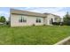 Backyard features lush green lawn, and a patio seating area perfect for outdoor gatherings at 5957 Haywood Ct, Greenwood, IN 46142