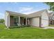 Charming single-story home featuring a well-manicured lawn and welcoming front porch at 5957 Haywood Ct, Greenwood, IN 46142