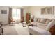 Spacious living room with a large window, a comfortable sectional, and stylish decor at 5957 Haywood Ct, Greenwood, IN 46142