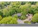 Aerial view of a charming home nestled among lush, mature trees in a tranquil neighborhood at 5958 Cape Cod Ct, Indianapolis, IN 46250