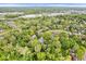 Wide aerial view showing a home in a peaceful, tree-lined residential neighborhood at 5958 Cape Cod Ct, Indianapolis, IN 46250