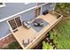 Aerial view of a backyard deck with outdoor furniture and lush greenery at 5958 Cape Cod Ct, Indianapolis, IN 46250