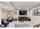 Finished basement featuring seating, entertainment center, and plenty of lighting at 5958 Cape Cod Ct, Indianapolis, IN 46250