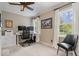 Comfortable bedroom featuring two bright windows, a modern desk, and a black accent chair at 5958 Cape Cod Ct, Indianapolis, IN 46250