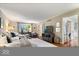 Bright living room features hardwood floors, neutral decor, and access to other parts of the house, creating a inviting space at 5958 Cape Cod Ct, Indianapolis, IN 46250