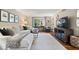 Inviting living room boasts hardwood floors, a comfortable sofa, and a modern entertainment center, creating a stylish space at 5958 Cape Cod Ct, Indianapolis, IN 46250