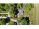 Aerial view showcasing the property's large lot, mature trees, and overall setting at 5979 E Oak Hl Dr, Plainfield, IN 46168