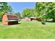 Spacious backyard featuring a storage shed and view of the home's back patio at 5979 E Oak Hl Dr, Plainfield, IN 46168