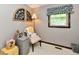 Bright bedroom featuring a cozy reading nook with decorative wall art at 5979 E Oak Hl Dr, Plainfield, IN 46168