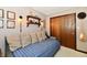 Bedroom with a daybed, charming decor, and unique wall lighting to create a relaxing, inviting space at 5979 E Oak Hl Dr, Plainfield, IN 46168