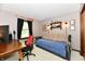 Comfortable bedroom featuring a cozy daybed, wooden desk, and charming decor for a relaxing atmosphere at 5979 E Oak Hl Dr, Plainfield, IN 46168