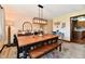 Dining room with decorative lighting, neutral color scheme, seating for six, and accent pieces at 5979 E Oak Hl Dr, Plainfield, IN 46168