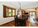 Dining room features hardwood flooring, bay window, decorative lighting, and easy access to back patio at 5979 E Oak Hl Dr, Plainfield, IN 46168