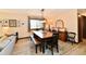 Open dining room with natural light, modern chandelier, seating for six, and decorative details at 5979 E Oak Hl Dr, Plainfield, IN 46168
