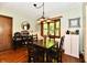 Traditional dining room boasts wood floors, window view, decorative lighting, and adjacent furnishings at 5979 E Oak Hl Dr, Plainfield, IN 46168