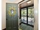 Welcoming entryway with a decorative wreath on the door and security gate at 5979 E Oak Hl Dr, Plainfield, IN 46168