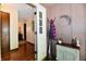 Charming entryway featuring a coat rack, cabinet, and view into the home at 5979 E Oak Hl Dr, Plainfield, IN 46168