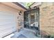 Covered front porch with a security door and potted plants adding a welcoming touch at 5979 E Oak Hl Dr, Plainfield, IN 46168