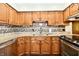 Spacious kitchen featuring stainless steel appliances and granite countertops at 5979 E Oak Hl Dr, Plainfield, IN 46168