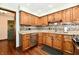 Well-lit kitchen featuring granite countertops and mosaic backsplash at 5979 E Oak Hl Dr, Plainfield, IN 46168