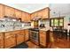 Charming kitchen with wood cabinets, stainless steel appliances, and breakfast nook at 5979 E Oak Hl Dr, Plainfield, IN 46168