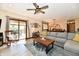 Bright living room featuring sliding doors to the outdoor deck, and an open concept to dining area at 5979 E Oak Hl Dr, Plainfield, IN 46168
