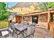 Patio space featuring an outdoor dining area with overhead shade and a view of the home's backyard at 5979 E Oak Hl Dr, Plainfield, IN 46168